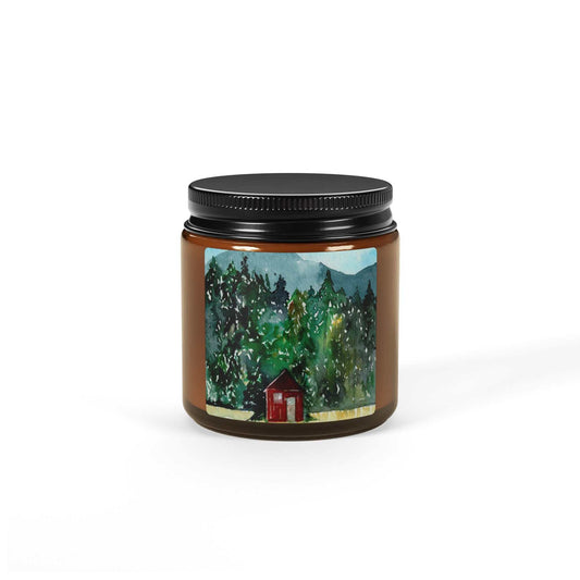 Hand-poured soy candle in amber jar with cabin design for cozy, rustic ambiance