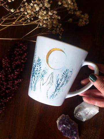 White ceramic Flower Moon Latte Mug with floral design, 12oz capacity, perfect for coffee lovers