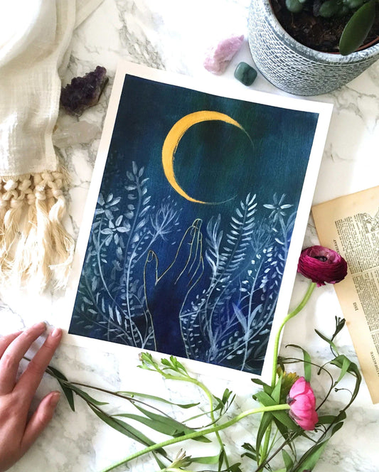 Flower Moon Art Print featuring hand reaching towards crescent moon with floral background on marble surface